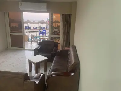 a living room with a couch and a table at vision suites Arbia Hurghada in Hurghada