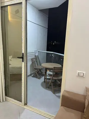 a mirror in a room with a table and a chair at Scandic resort private beach in Hurghada