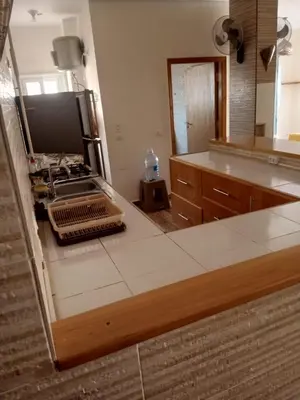 a kitchen with a stove and a counter top at City centre Carrefour in Hurghada