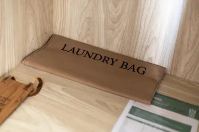 a library bag sitting on top of a wooden table at The Kaktus Somabay in Hurghada