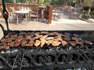 a grill with a bunch of food on it at Lucky Nile Tours in Luxor