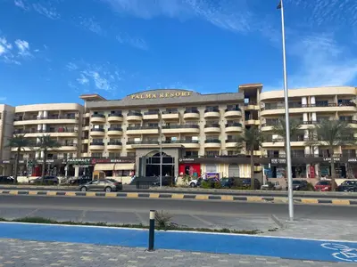 a large building with a road in front of it at vintage sea view apartment in Hurghada