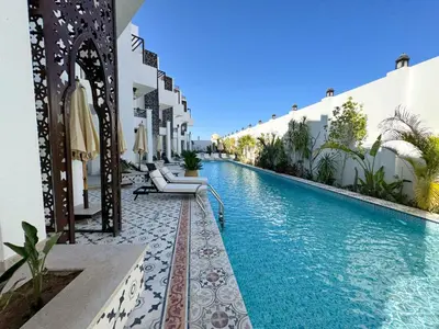 a swimming pool in the middle of a building at Arаbian Suites by Imperial in Hurghada