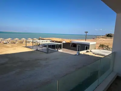 a building with a view of the beach and the ocean at Sea view chalet hurghada in Hurghada