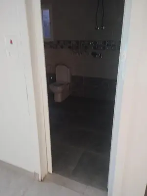an open door to a bathroom with a toilet at Studio in Villa in Hurghada
