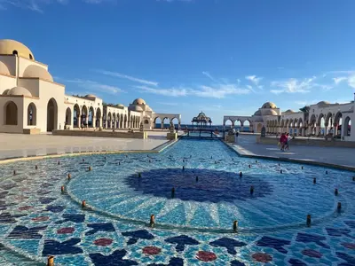 a fountain in the courtyard of a building at Cozy Suite in Azzurra Resort Sahl Hasheesh 95 SqM in Hurghada