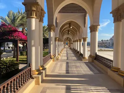 an arcade of a building with columns and arches at Cozy studio in Azzurra Resort Sahl Hasheesh 65 Sq M in Hurghada