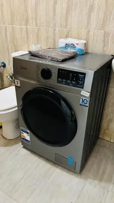 a microwave sitting on the floor next to a toilet at Boho Oasis - Studio Hurghada Red Sea in Hurghada