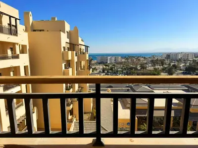 a view of a city from a balcony with buildings at Apartment Aldau in Hurghada