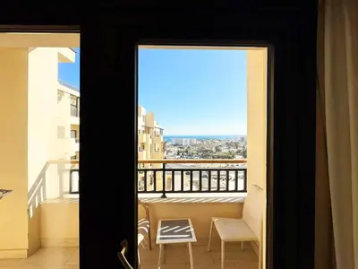 a view of a balcony from a room with a window at Apartment Aldau in Hurghada
