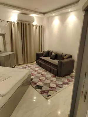 a living room with a couch and a rug at Hurghada Fiesta Resort Studio 232 Beach in Hurghada