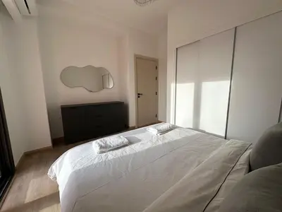 a bedroom with a large white bed with a window at Kamaran El Gouna - 1 bed ground in Hurghada