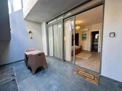 a room with a bench and a room with a bedroom at Bali Gouna 1 bed - heated pool in Hurghada