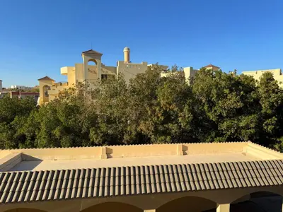 a roof of a building with a city in the background at Aldau Maxico in Hurghada