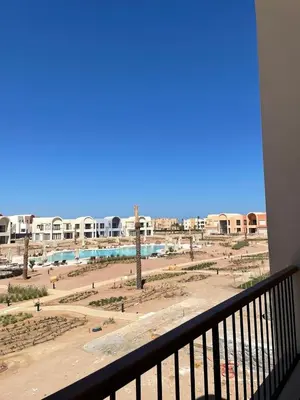 a view of a beach from a balcony at Luxurious 3Bd Living Awaits in El Gouna in Hurghada