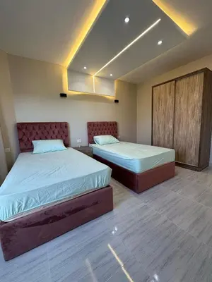 two beds in a room with two beds sidx sidx sidx sidx at 2 Bedroom in Al Hambra - Mamsha in Hurghada