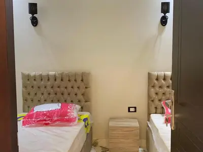 a bedroom with two beds with at 2 Bedroom in Andreas Residence in Hurghada