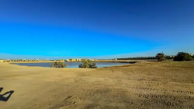 a view of a beach with a body of water at Elite AlDaU Heights in Hurghada