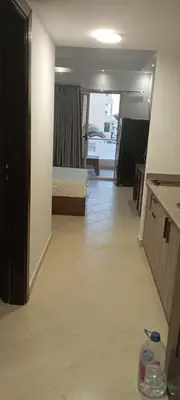 a room with a bedroom and a bed in a room at Compound floranza in Hurghada