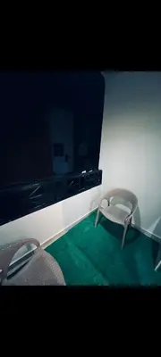 a room with two chairs and a mirror at Apartment in hurghada at hadba St in Hurghada