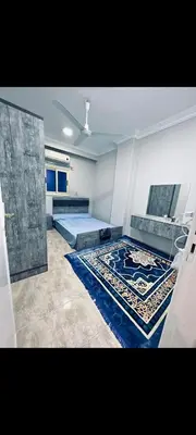 a large room with two beds and a rug at Apartment in hurghada at hadba St in Hurghada