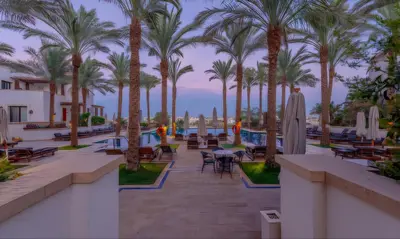 a resort with palm trees and a swimming pool at Luxury Stays in Ancient Sands El Gouna in Hurghada