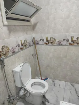 a bathroom with a white toilet in a room at Fully furnished studio with all services and amenities close to the beach in Hurghada