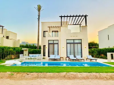 a house with a swimming pool in front of it at Luxury villa in gouna in Hurghada