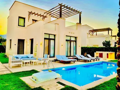 a house with a swimming pool in front of it at Luxury villa in gouna in Hurghada
