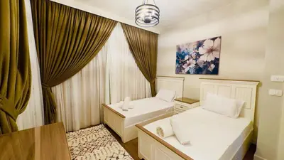a room with two beds and a window at Luxury villa in gouna in Hurghada