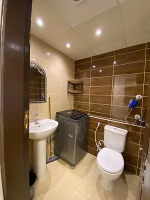a bathroom with a toilet and a sink at Florienza resort in Hurghada