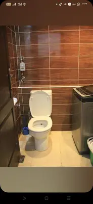 a bathroom with a white toilet in a room at Florienza resort in Hurghada