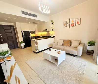 a living room with a couch and a table at Hotel Apartment 1 very nice and quiet hurghada in Hurghada