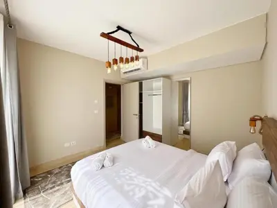 a bedroom with a large white bed in a room at Luxury 5 Bedrooms Sea Front Villa in Hurghada