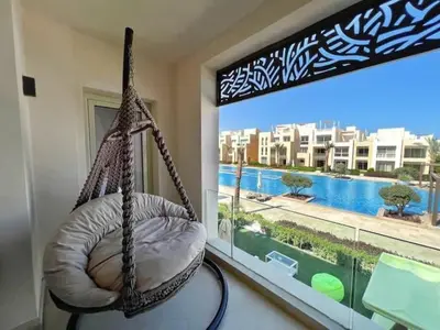 a hanging hammock in a room with a window at Luxury 5 Bedrooms Sea Front Villa in Hurghada