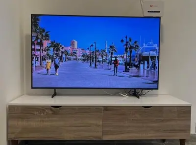 a flat screen tv sitting on top of a dresser at Aqua Infinity Oasis walking distance to beach, 15 minutes from El Gouna, 15 minutes from central Hurghada in Hurghada