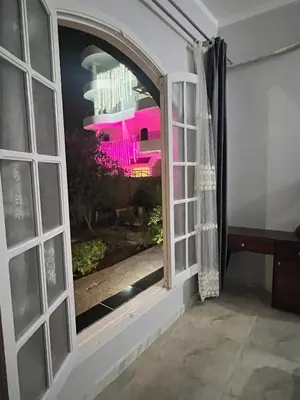 an open window with a view of a room at River view house in Luxor
