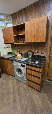 a kitchen with a sink and a washing machine at Dive Hostel Hurghada Sea Light in Hurghada