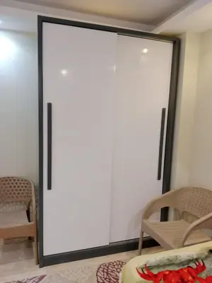 a sliding glass door in a room with chairs at Selena Bay Resort in Hurghada