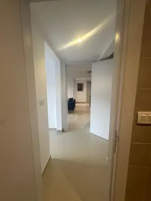 an empty hallway with a hallway leading to a living room at G Cribs Hotel Apartment 2BR in Hurghada