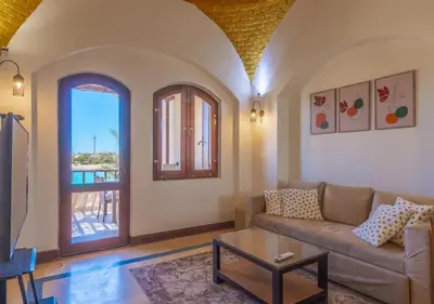 a living room with a couch and a table at Dreamy 1BR in Italian Compound, Nubia, El Gouna in Hurghada