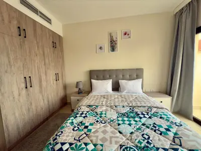 a bedroom with a bed with a quilt on it at Luxury hotel apartment 2rooms with triple sea view in Hurghada