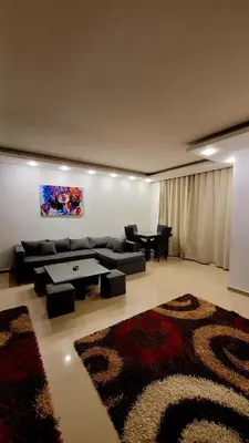 a living room with a couch and a table at touristic centre hurghada in Hurghada