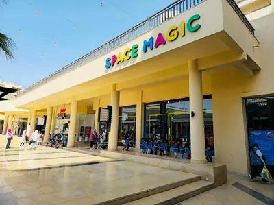 a large building with a sign on the side of it at Studio in Dow Heights Compound in Hurghada