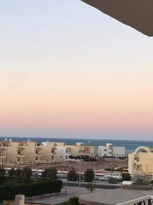 a view of a parking lot at sunset at كمبوند سكاي 2 in Hurghada