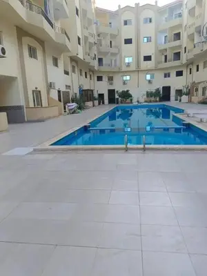 an empty swimming pool in a apartment building at كمبوند سكاي 2 in Hurghada