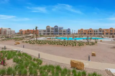 a resort with a swimming pool and a resort at Chic 1 BR with private jacuzzi in Banī Ghālib