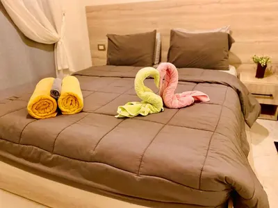 a bed with two flamingos on top of it at B1-04 Juliana in Hurghada
