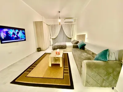 a living room with a couch and a table at B1-04 Juliana in Hurghada
