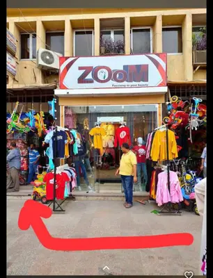 a man standing in front of a zoom store at Aswan cozy apartment in Aswan